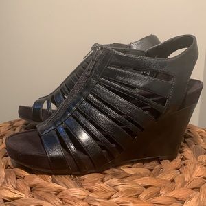 Brand new in box black aerosols wedge size 7M.